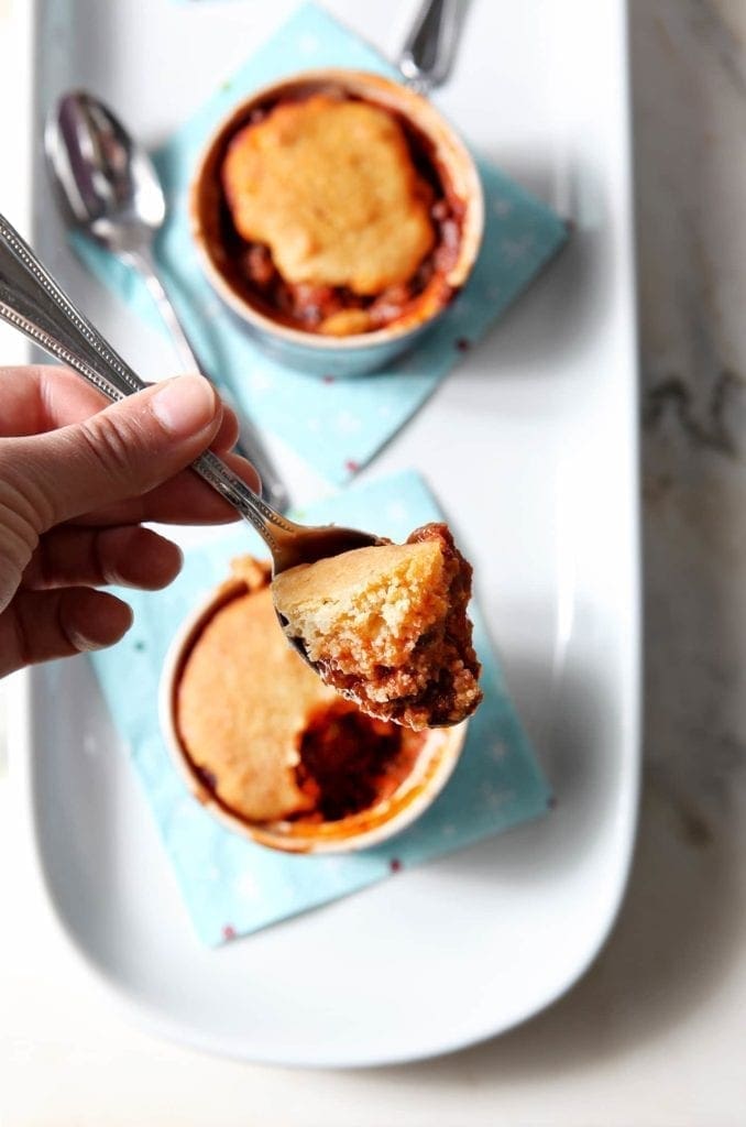 Spoonful of chili from a bowl of chili cornbread pot pie 