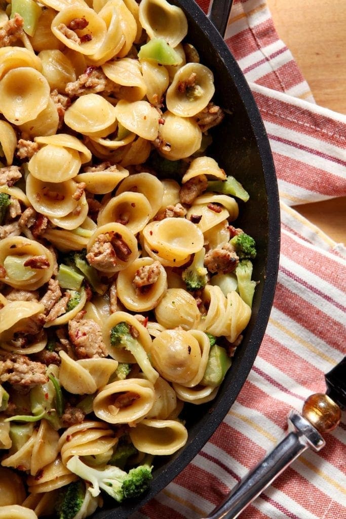 Turkey and Broccoli Orecchiette in skillet on linens 