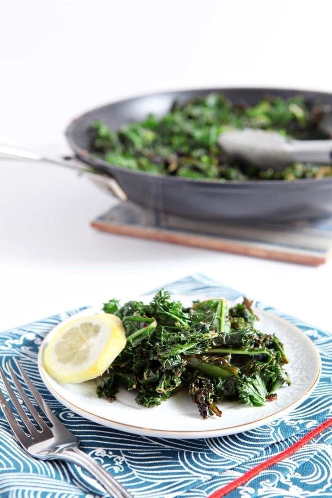 Small plate of Lemon Kale with slice of lemon 