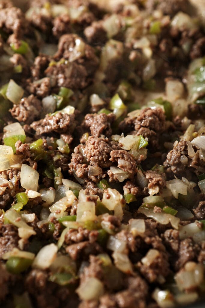 Close up of cooked beef and veggies in a skillet