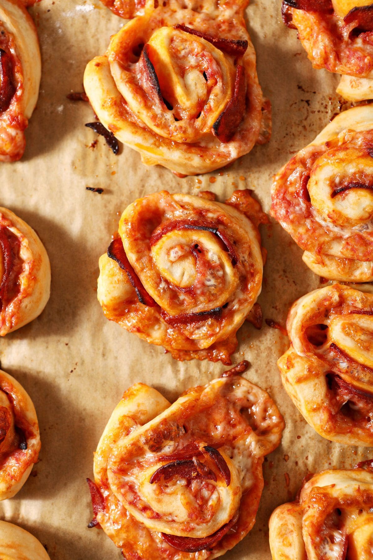 Baked pizza rolls on a sheet pan