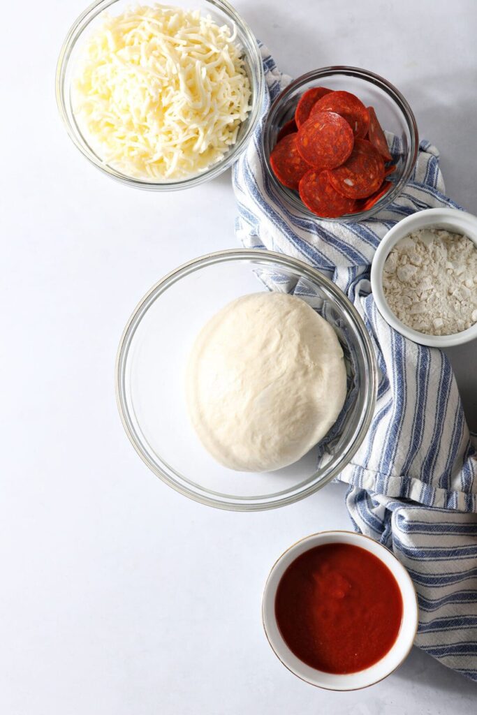 Ingredients to make pizza rolls at home