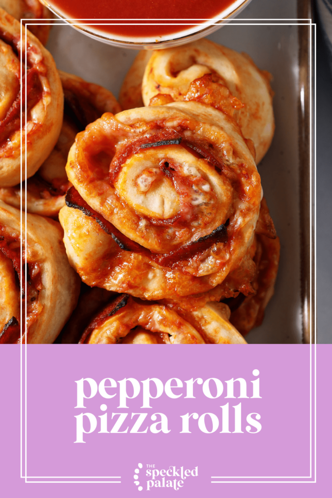 Overhead of pizza swirls with marinara sauce with the text pepperoni pizza rolls