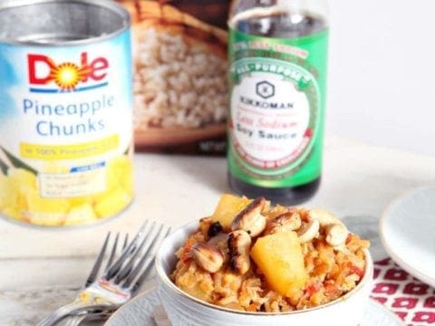 Bowl of Pineapple Fried Rice in front of packaged ingredients 