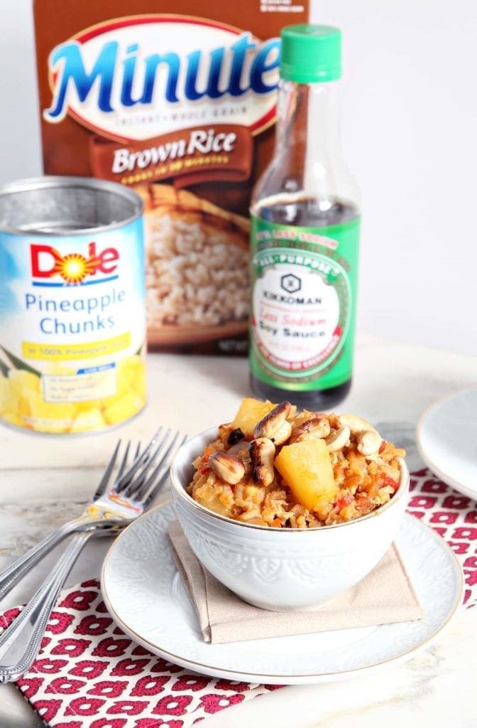 Bowl of Pineapple Fried Rice in front of packaged ingredients 