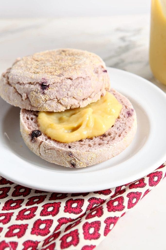 Orange curd on top of sliced muffin 