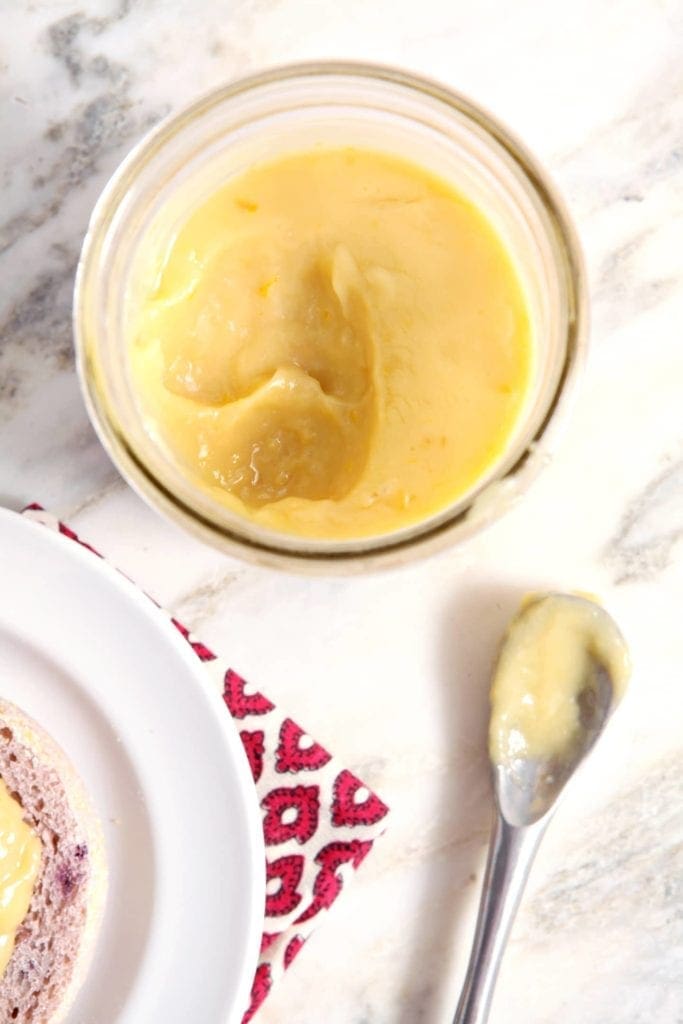 Overhead view of Orange Curd in glass jar 