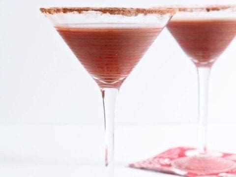 Two cocktail glasses of Vanilla Hot Chocolate Martinis on red napkins
