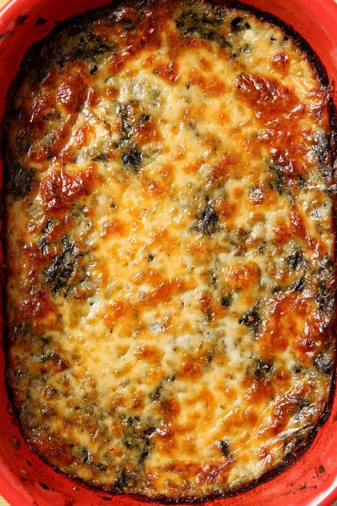 Spinach Madeline is a comforting side that is a spicy twist on traditional creamed spinach. Instead of just cream, the spinach is mixed with pepperjack cheese and spices, then baked to make this outstanding vegetarian side dish that pairs well with most meals!