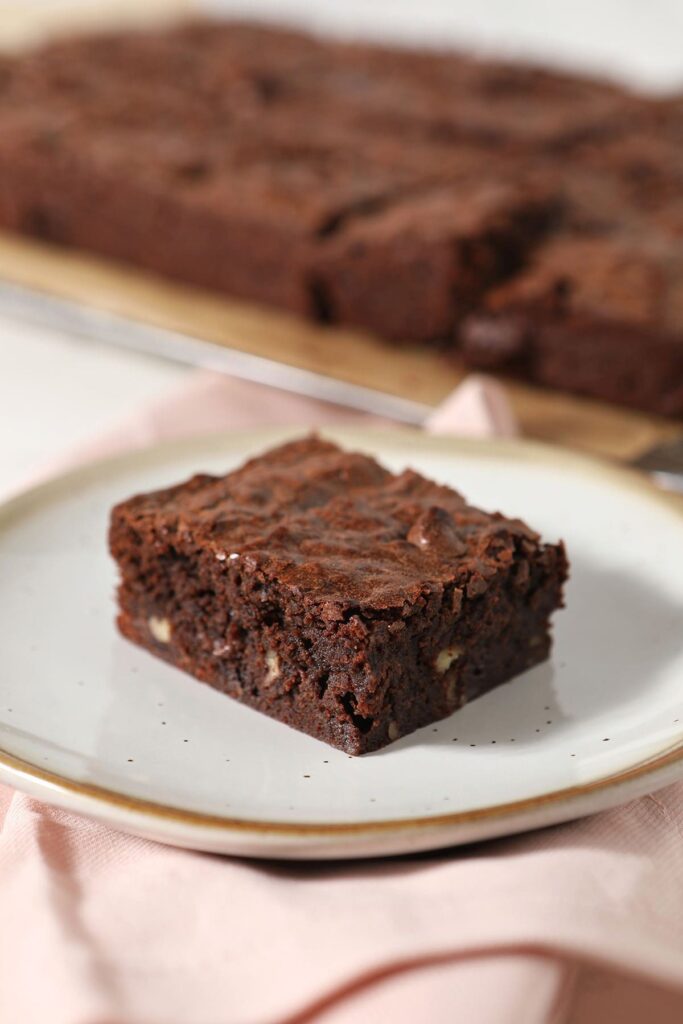 A bourbon pecan brownie on a plate