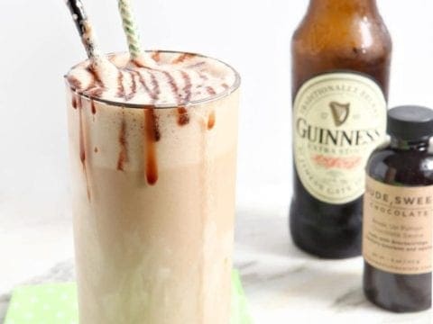 salted caramel guinness float in a glass with a bottle behind