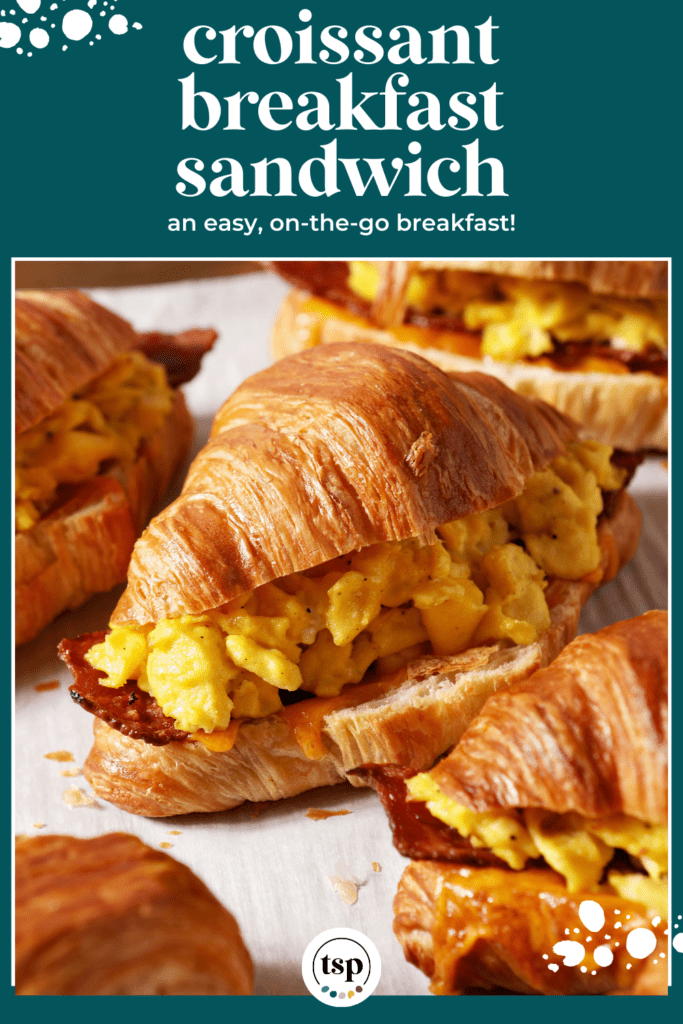 croissant breakfast sandwiches on a sheet pan after baking with the text croissant breakfast sandwich an easy, on-the-go breakfast