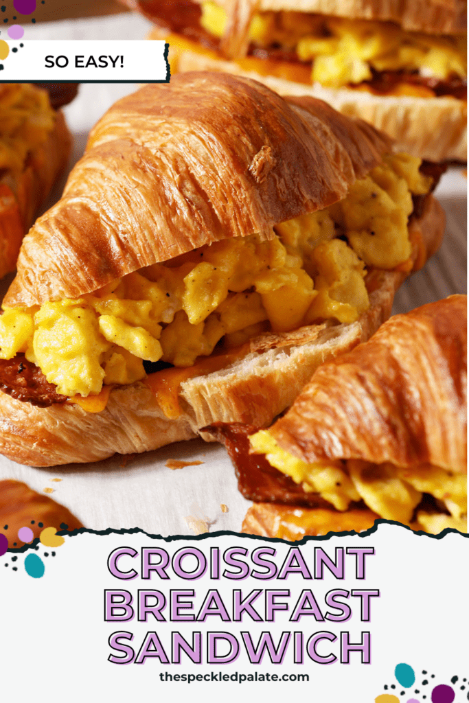 breakfast sandwiches on a sheet pan after baking with the text croissant breakfast sandwich