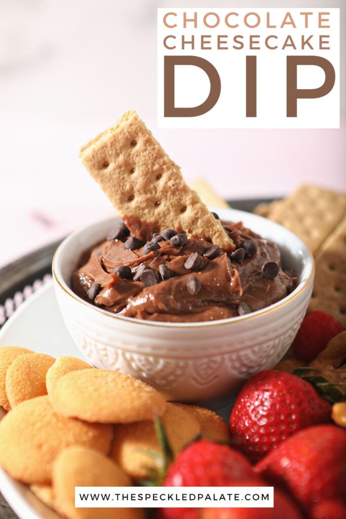 A graham cracker sits inside a bowl of chocolate cheesecake dip with the text 'chocolate cheesecake dip'