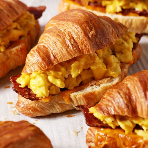 croissant breakfast sandwiches on a sheet pan after baking