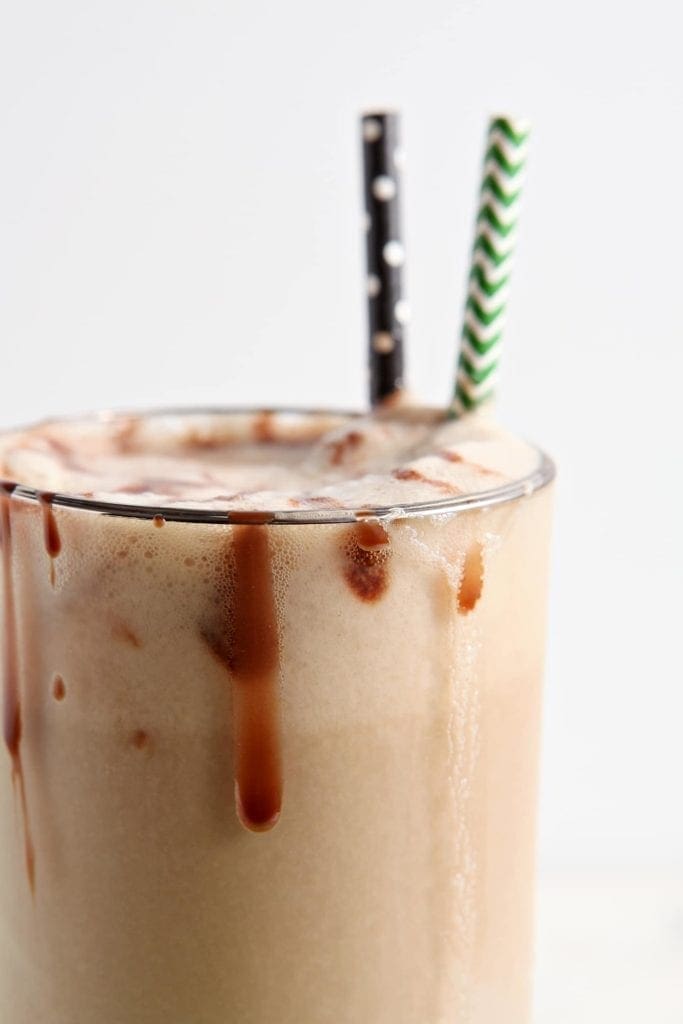 Close up of chocolate sauce drizzling down the side of a beer float