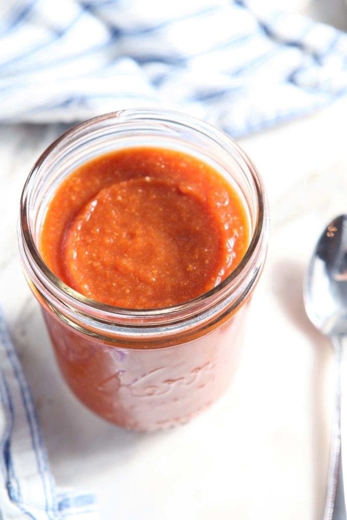 Overhead view of Enchilada Sauce in glass jar 