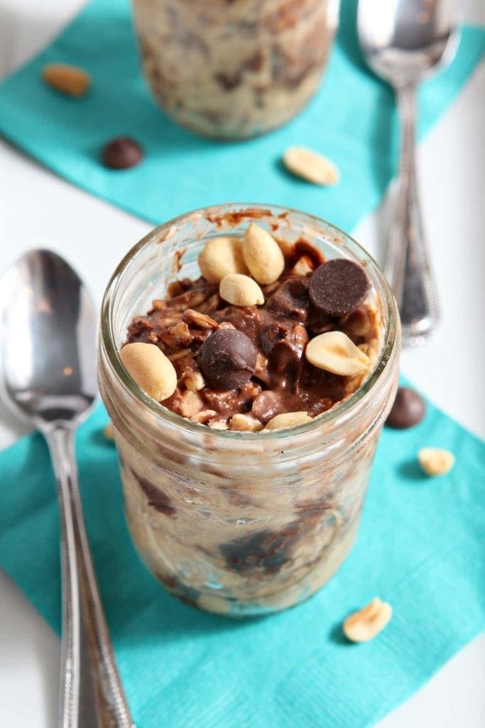 chocolate chip overnight oats in a glass jar with a spoon