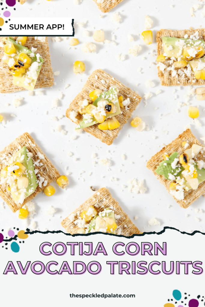 Overhead image of a corn-avocado and cotija mixture on crackers on a white platter with the text Cotija Corn Avocado Triscuits