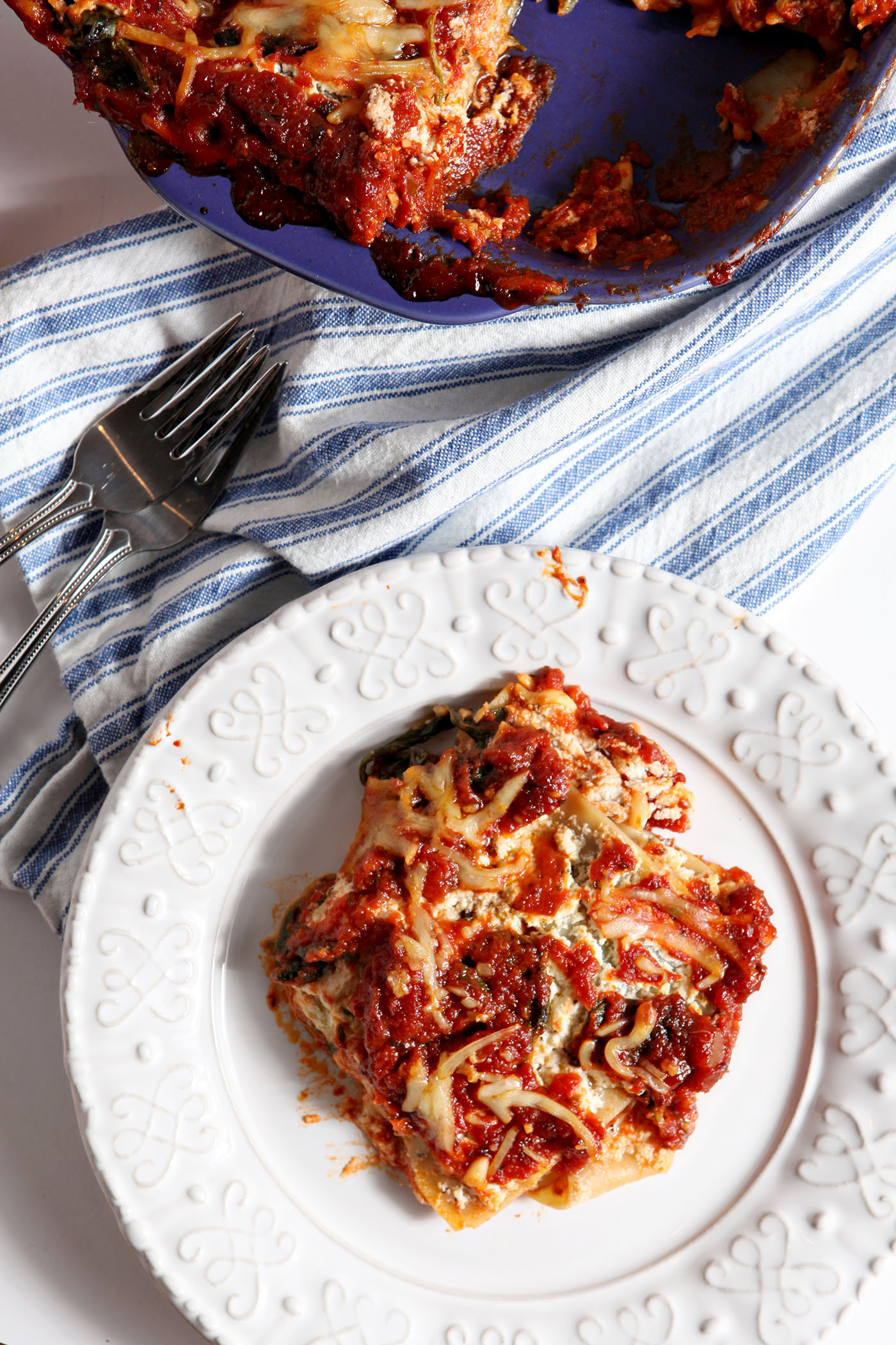 This Spinach Lasagna recipe is a simple, delicious and balanced meal! Calling for store-bought staples and simple ingredients, this is the best kind of comfort food... and it can be made in advance for any evening or occasion.