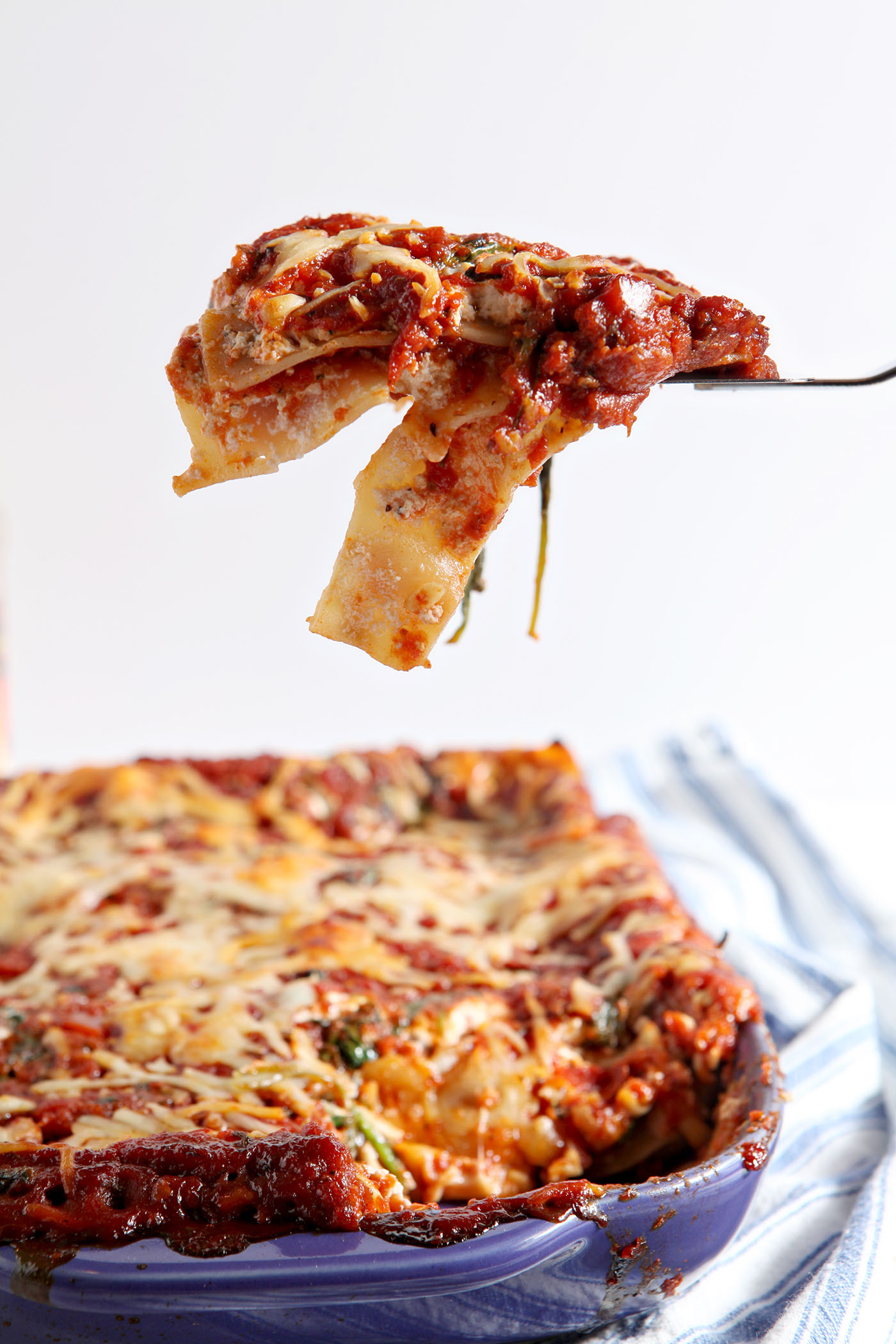 This Spinach Lasagna recipe is a simple, delicious and balanced meal! Calling for store-bought staples and simple ingredients, this is the best kind of comfort food... and it can be made in advance for any evening or occasion.