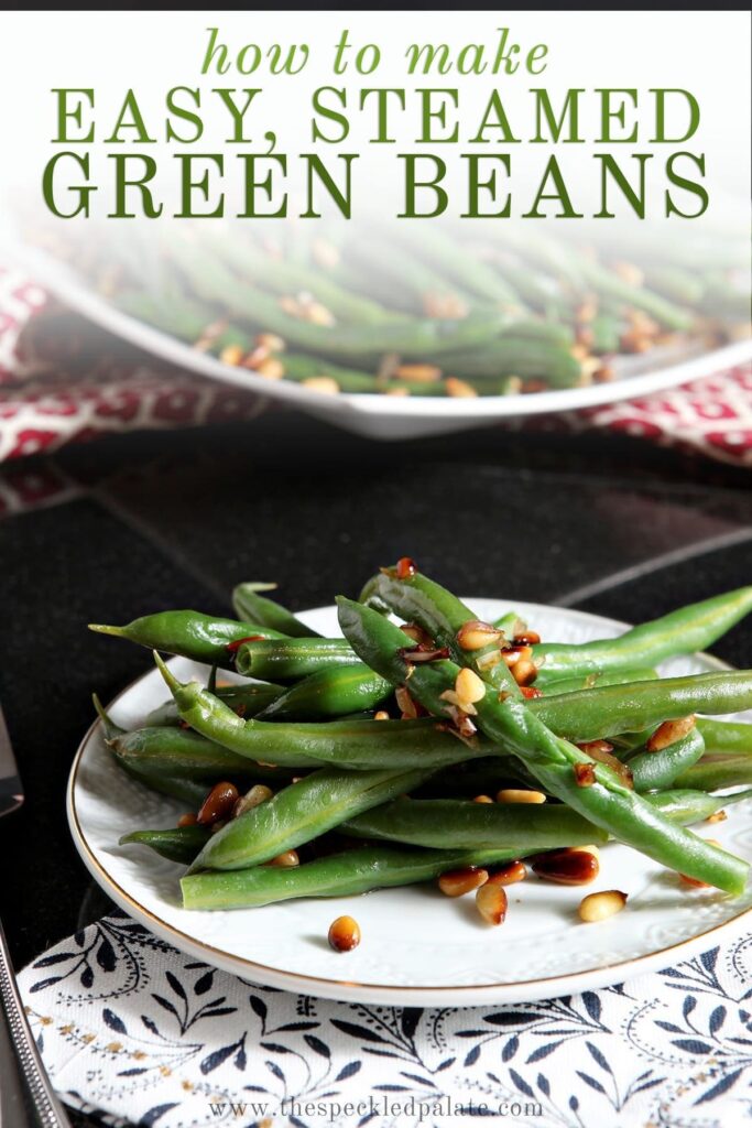 A white plate holds a serving of Vegan Green Beans with Toasted Pine Nuts and shallots with the text 'how to make easy, steamed green beans'