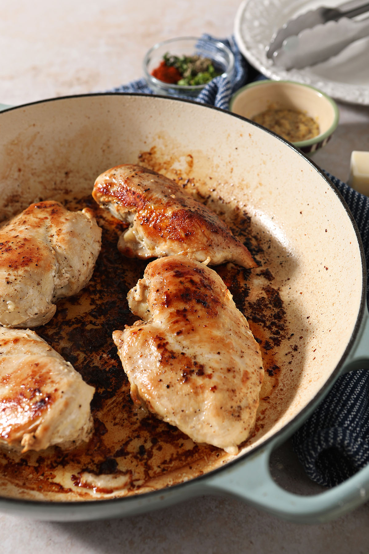 Seared chicken beasts in a skillet