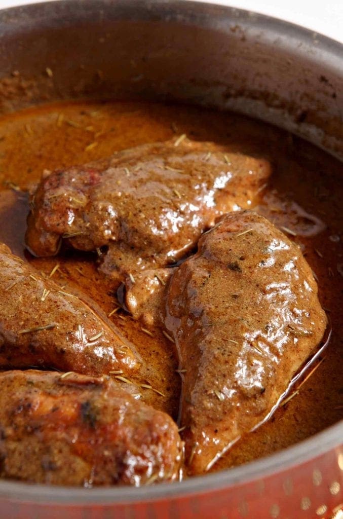 Mustard chicken in a saute pan before serving