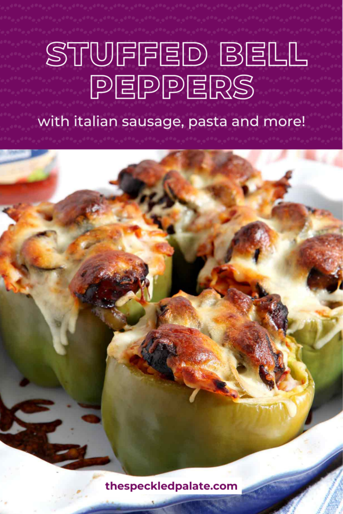 Close up of baked peppers topped with cheese in a pan with the text Stuffed Bell Peppers with italian sausage, pasta and more