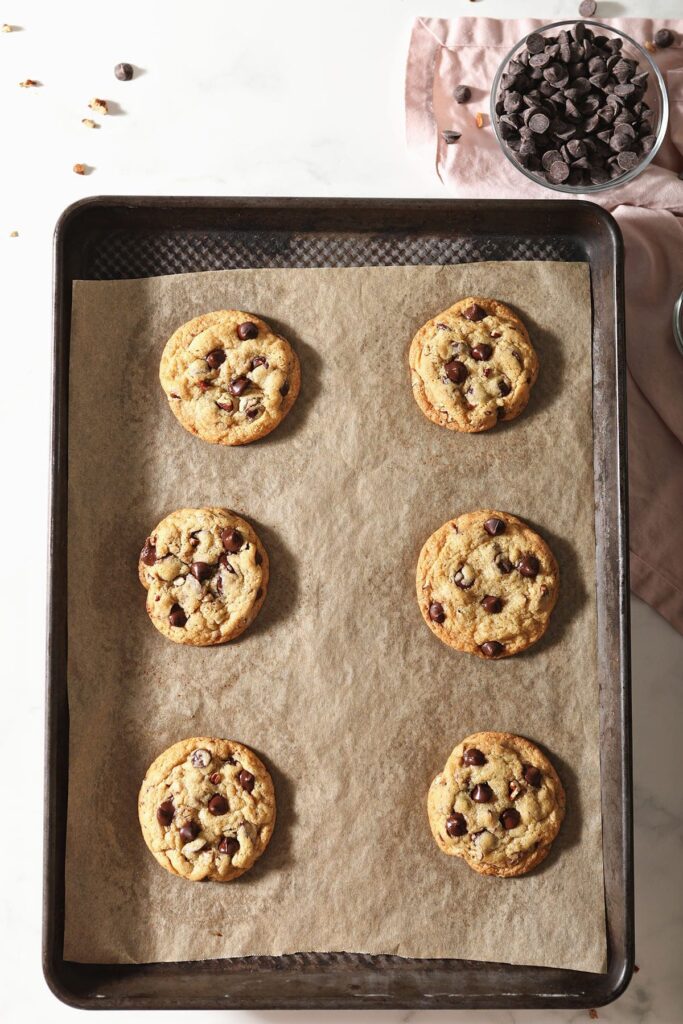 Pecan Chocolate Chip Cookies on a sheet pan