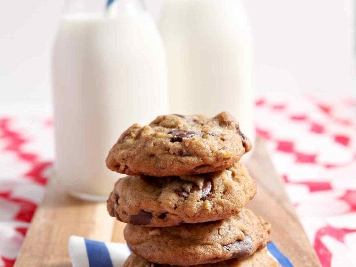 All-American Chocolate Chip Cookies are ooey, gooey and utterly delicious! This ultimate American sweet, which is studded with bittersweet chocolate chips and pecans, was adapted from a family friend's award-winning recipe. The batter comes together quickly and chills for at least an hour. When ready, scoop the dough onto a prepared baking sheet and bake until golden brown. Serve freshly baked, warm cookies with a cold glass of milk.