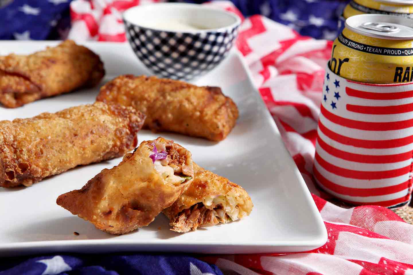 Cut in half eggroll on white platter 