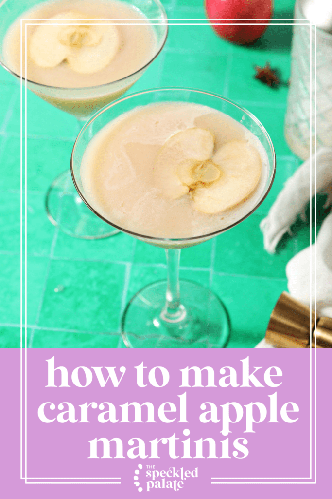 Two salted caramel apple martinis on a green tiled surface surrounded with spices and apples with the text how to make caramel apple martinis