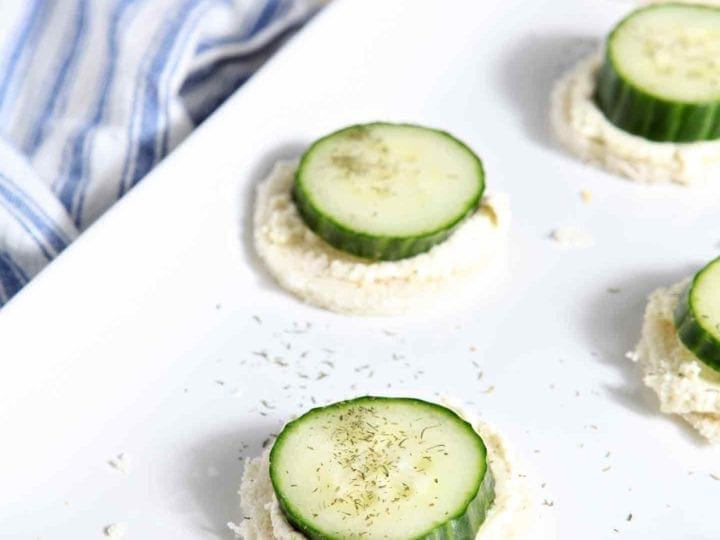 Cucumber slices on top of whipped spread on serving dish