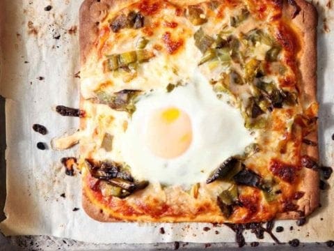 Overhead picture of cooked Hatch Chili Breakfast flatbread on baking sheet