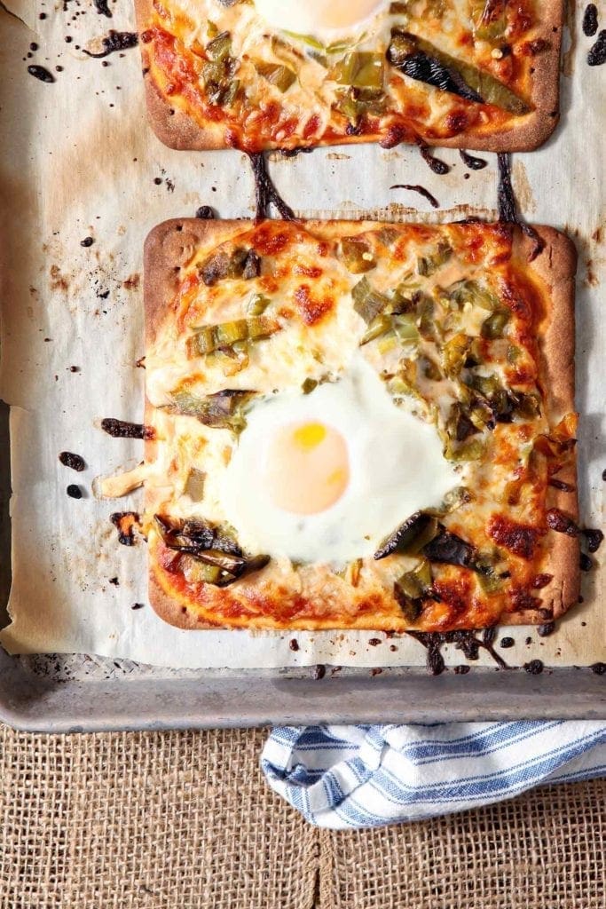 Overhead picture of cooked Hatch Chili Breakfast flatbread on baking sheet 