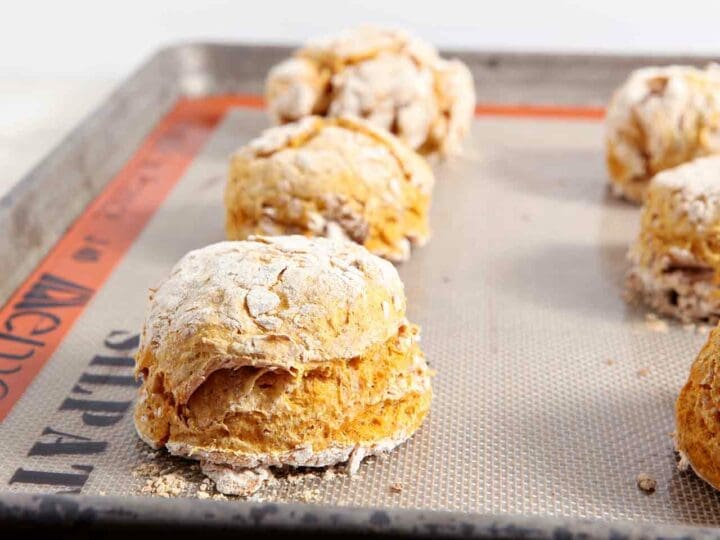 Close up of pumpkin biscuits on baking sheet