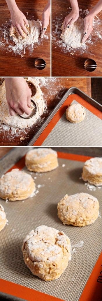 Hands cutting cutting out biscuit dough on baking sheet 