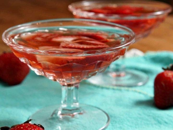 Close up of glasses with old fashioned and strawberries