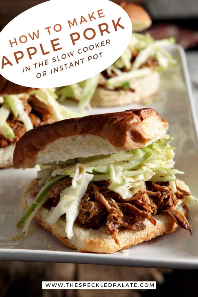 Three pulled pork sandwiches with apple slaw on a white platter with the text 'how to make apple pork in the slow cooker or instant pot'