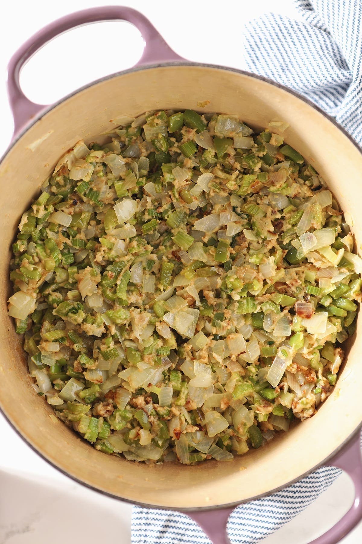 Sauteed onion, green bell pepper and celery in roux inside a Dutch oven