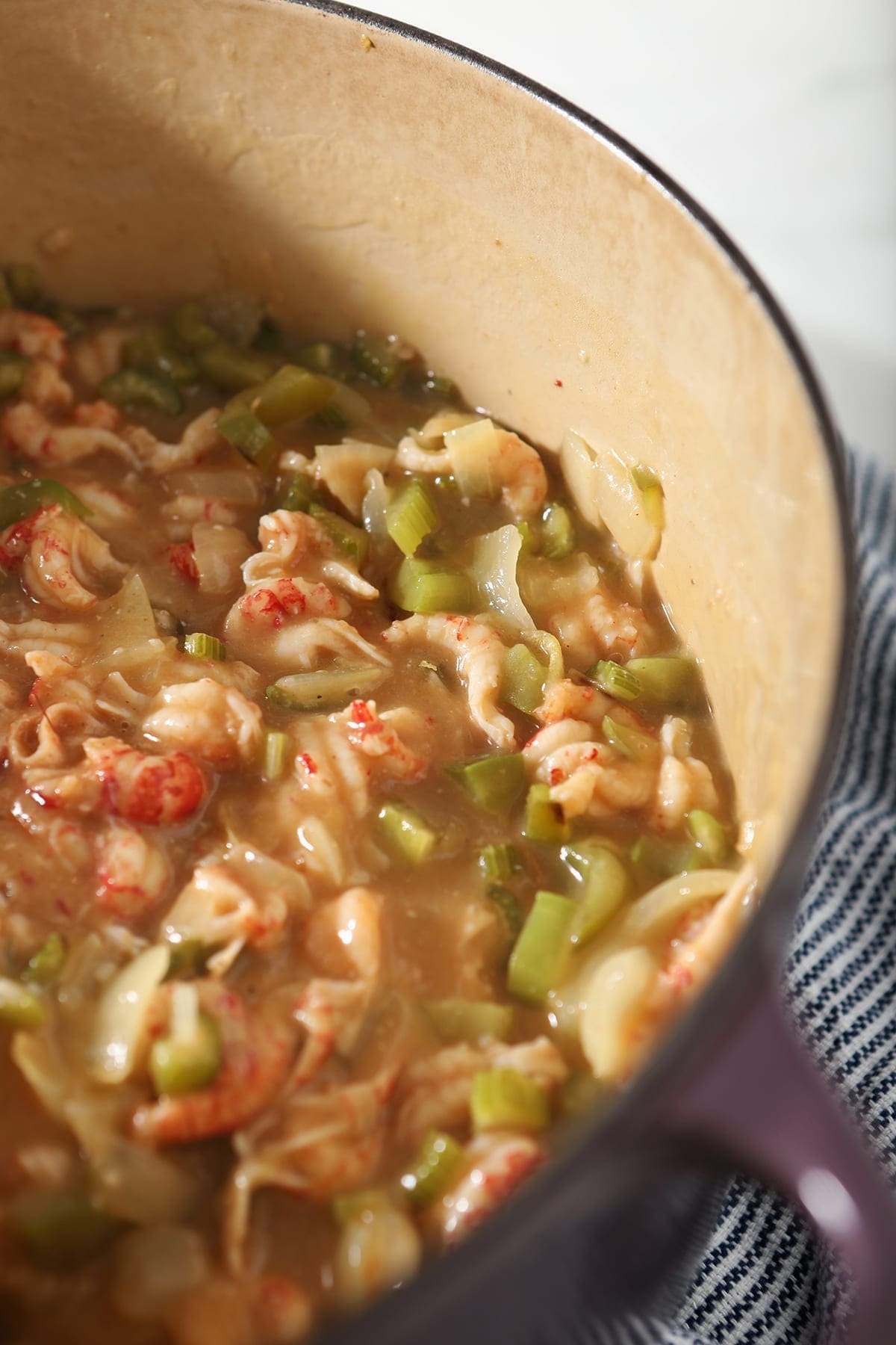 Close up of crawfish etouffee inside a dutch oven