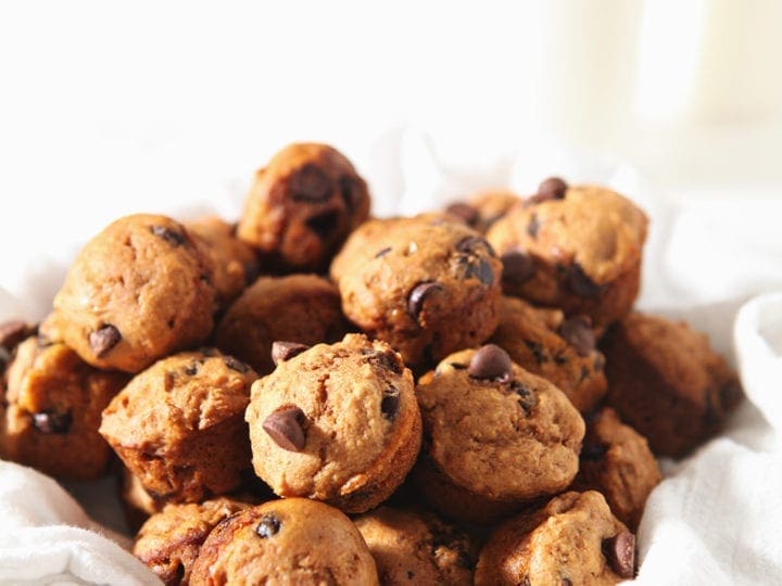 A bowl of Mini Pumpkin Muffins sit together before serving