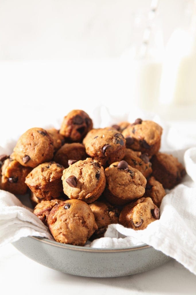 A bowl of Mini Pumpkin Muffins sit together before serving