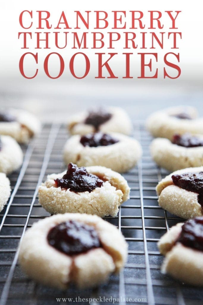 Orange Cranberry Cream Cheese Thumbprint Cookies cool on a wire rack, with Pinterest text