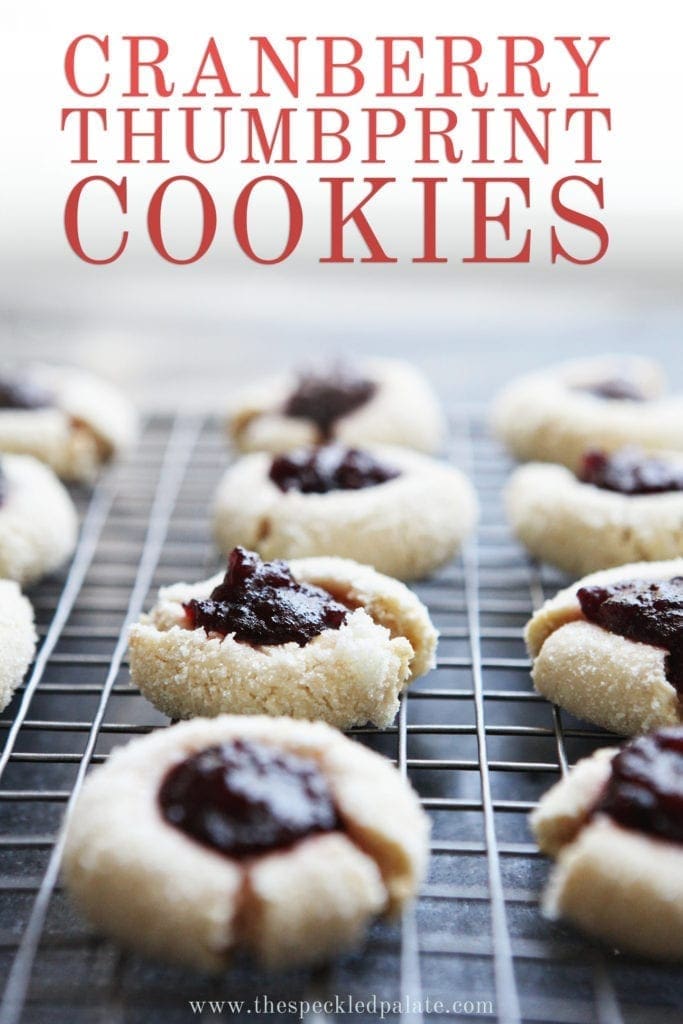 Orange Cranberry Cream Cheese Thumbprint Cookies cool on a wire rack, with Pinterest text