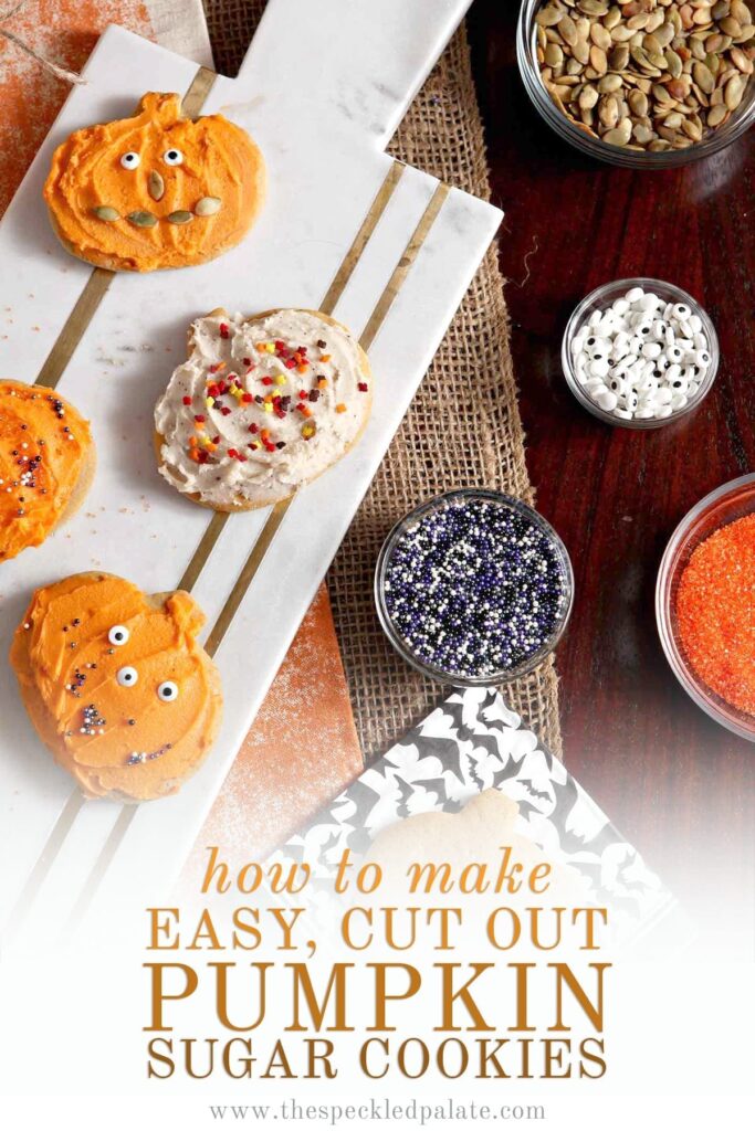 Decorated pumpkin cut out cookies sit on a marble slab next to bowls of sprinkles, eye candies, colored sugar and pumpkin seeds with the text 'how to make easy, cut out pumpkin sugar cookies'