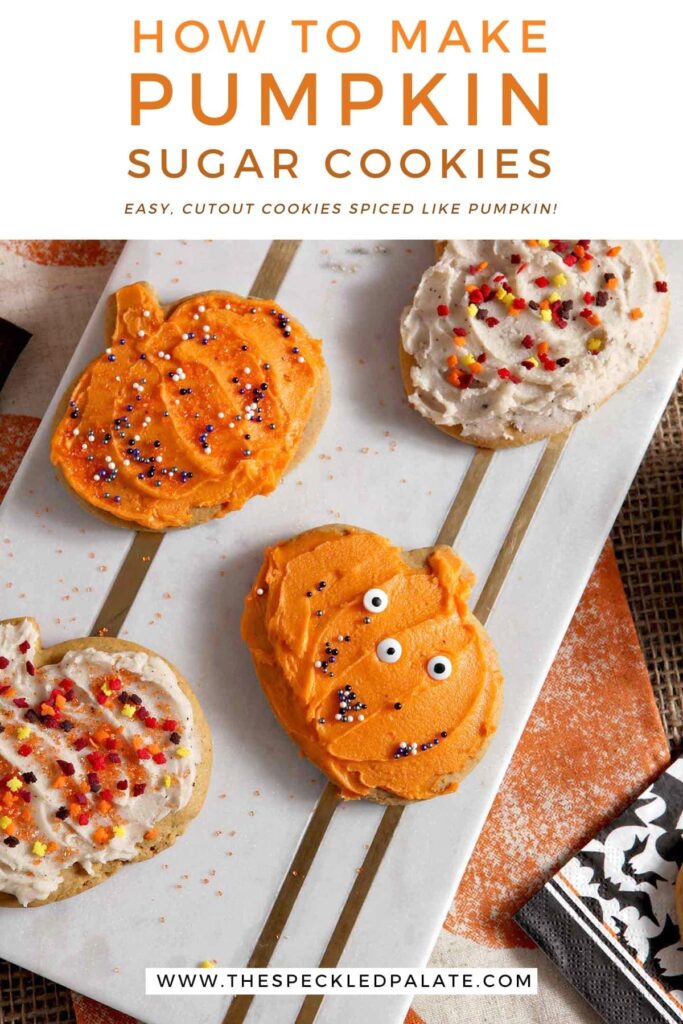 Decorated pumpkin cut out cookies sit on a marble slab with the text 'how to make pumpkin sugar cookies. easy cutout cookies spiced like pumpkins!'