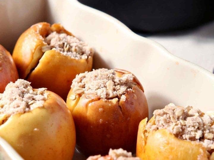 If you're in the market for a melt-in-your-mouth decadent side dish for the holiday table, you're in luck! Bacon Streusel Stuffed Baked Apples are a THING! Stuff apples with a sweet, spiced bacon fat streusel. Bake until the apples soften and the streusel browns, then serve warm alongside turkey or ham. These Bacon Streusel Stuffed Baked Apples are the ultimate sweet-savory-salty combination for Thanksgiving, Christmas or any winter dinner party!