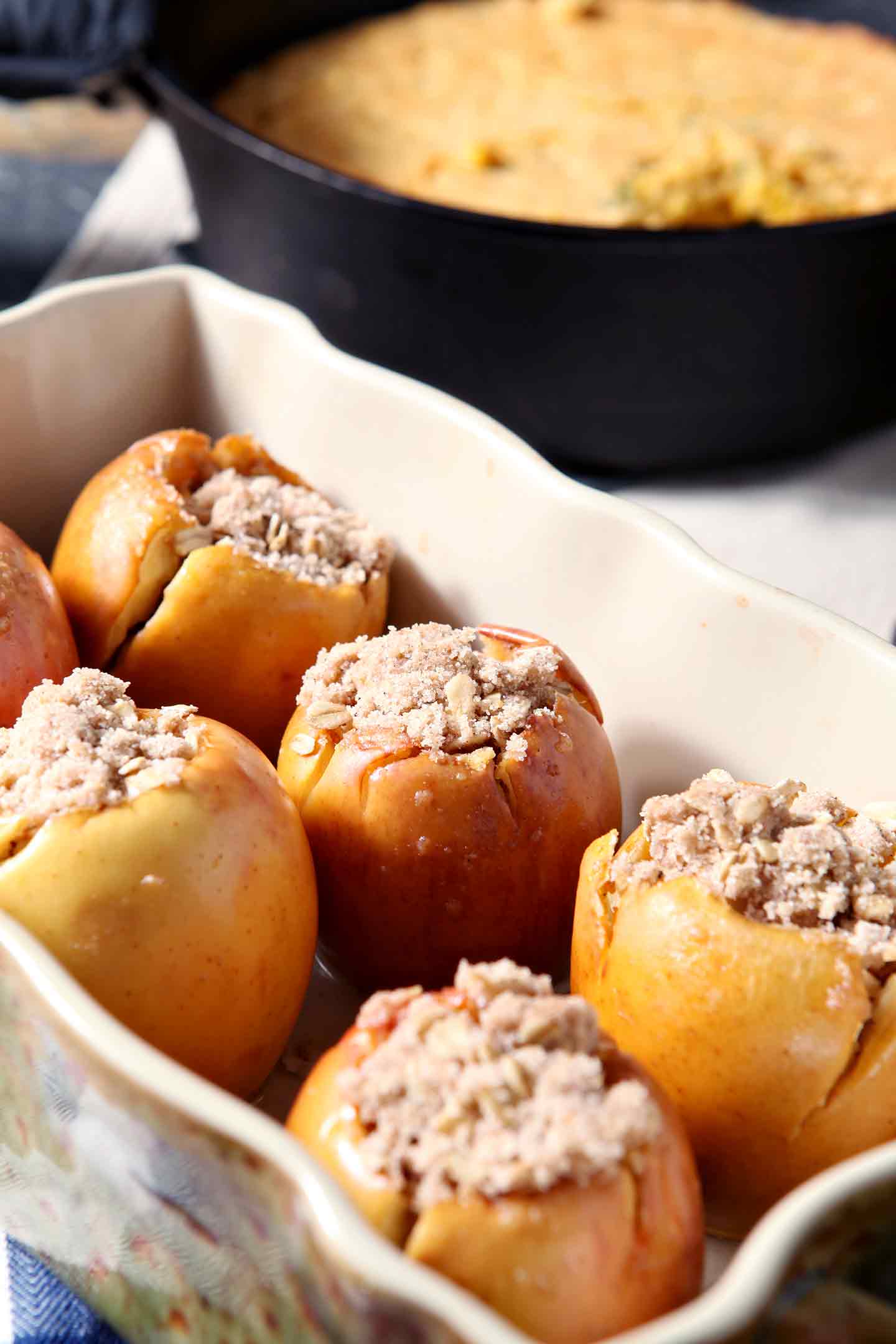 Close up of Bacon Streusel Stuffed Baked Apples in a baking dish